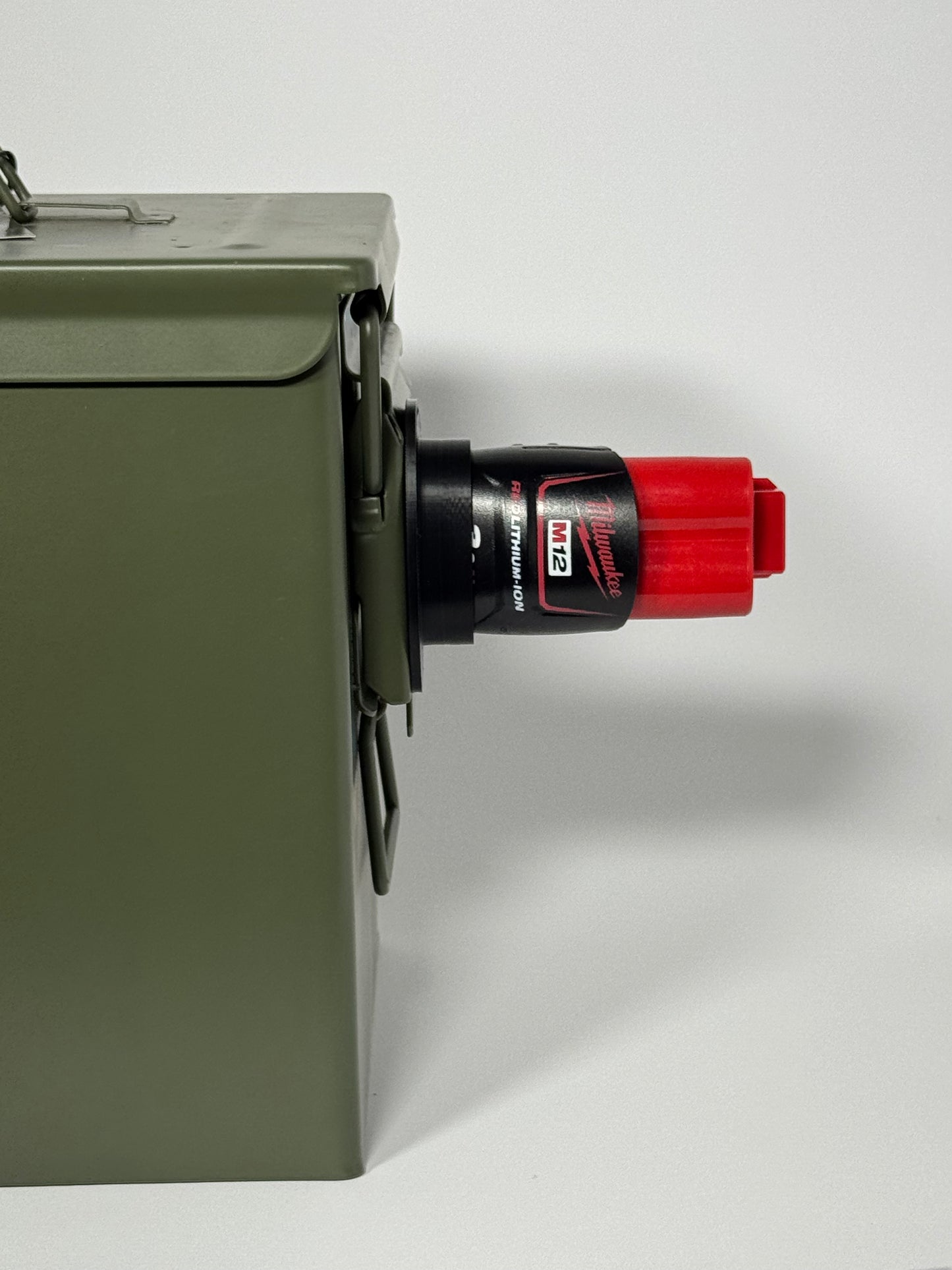 Milwaukee M12 battery holder with magnetic mount for secure storage and easy access.