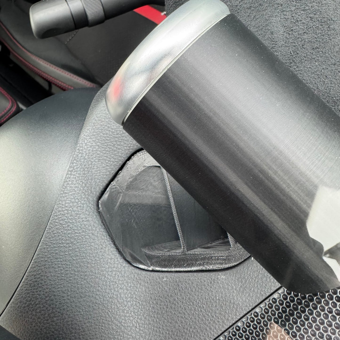 Top-down view of gauge pod mounted flush in driver air vent housing