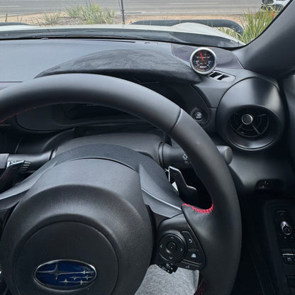 Front angle view of Toyota GR86 interior with aftermarket 52mm gauge pod