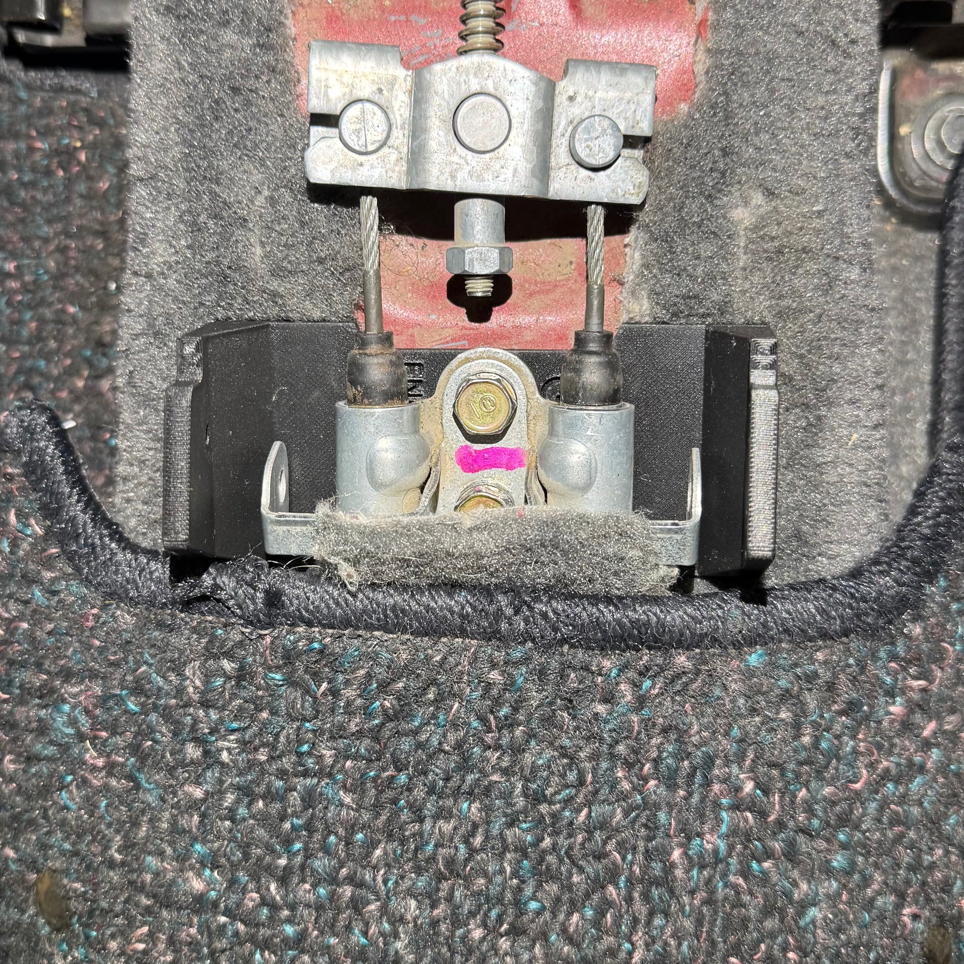 Top view of Honda Civic EK armrest bracket showing bolt pattern for easy installation.