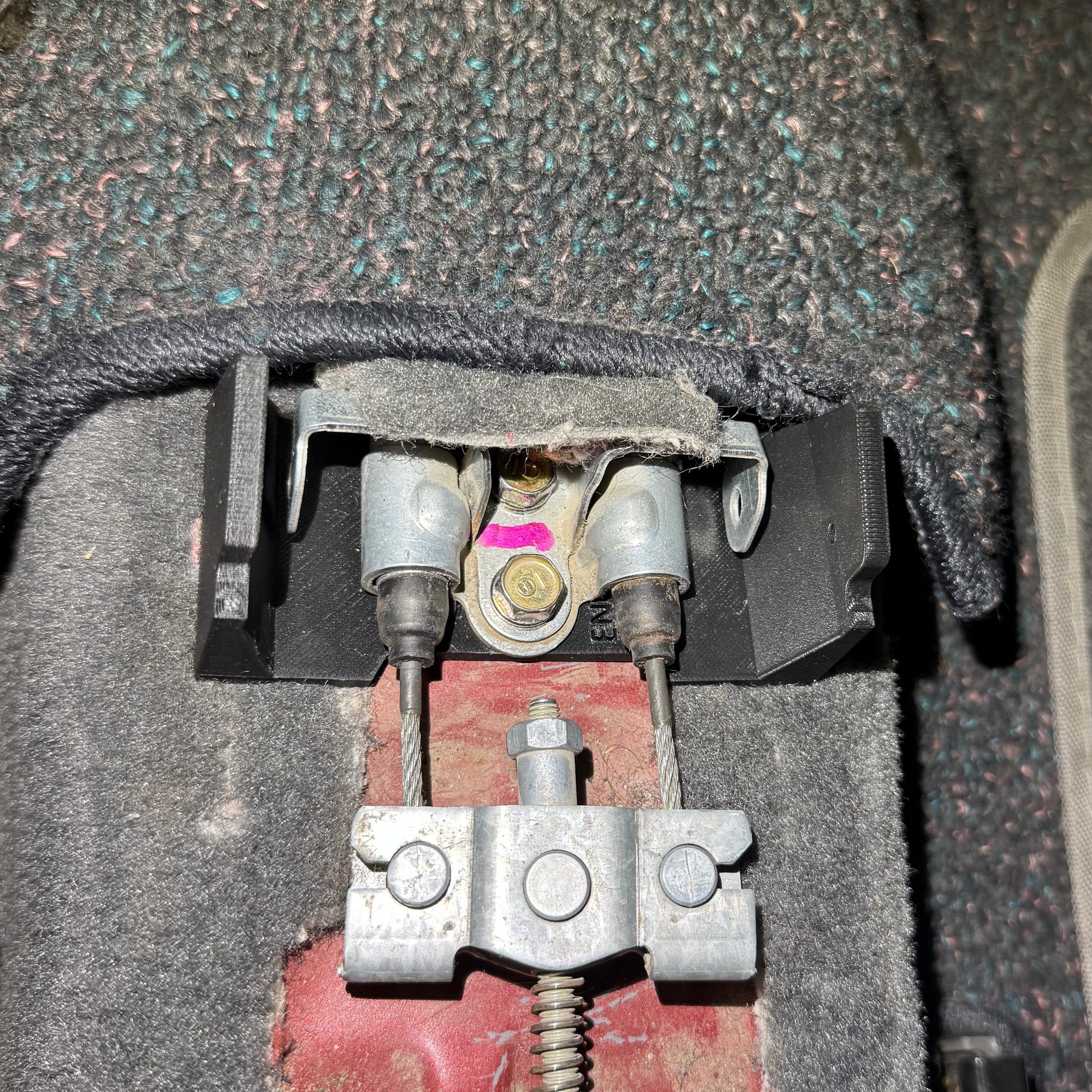 Aftermarket armrest mounting bracket compatible with Honda Civic EK console armrest assembly.