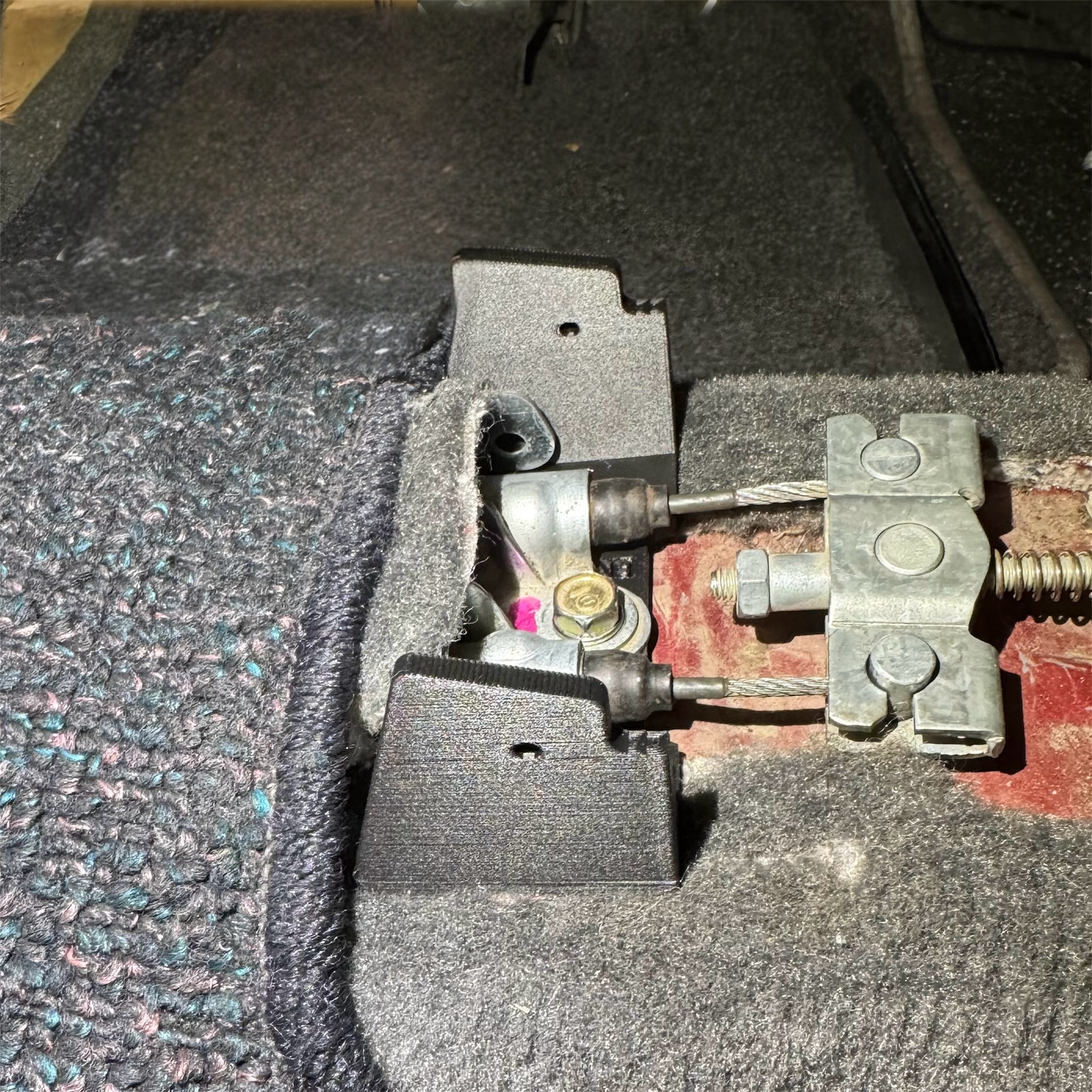 EK Civic armrest bracket fitment view with screws/fasteners shown for OEM-style replacement install.