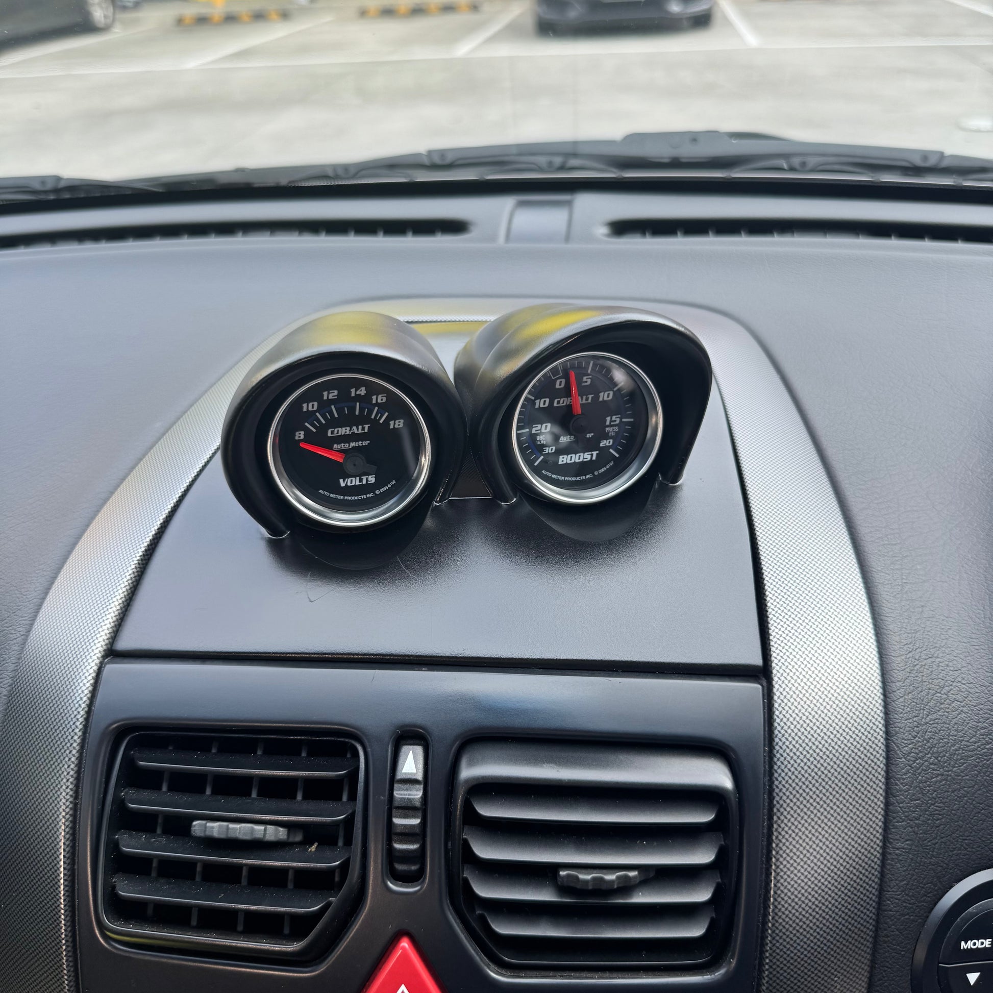 Close-up of painted VY gauge pod installed, showing tight panel gaps and OEM-style dash seam alignment.