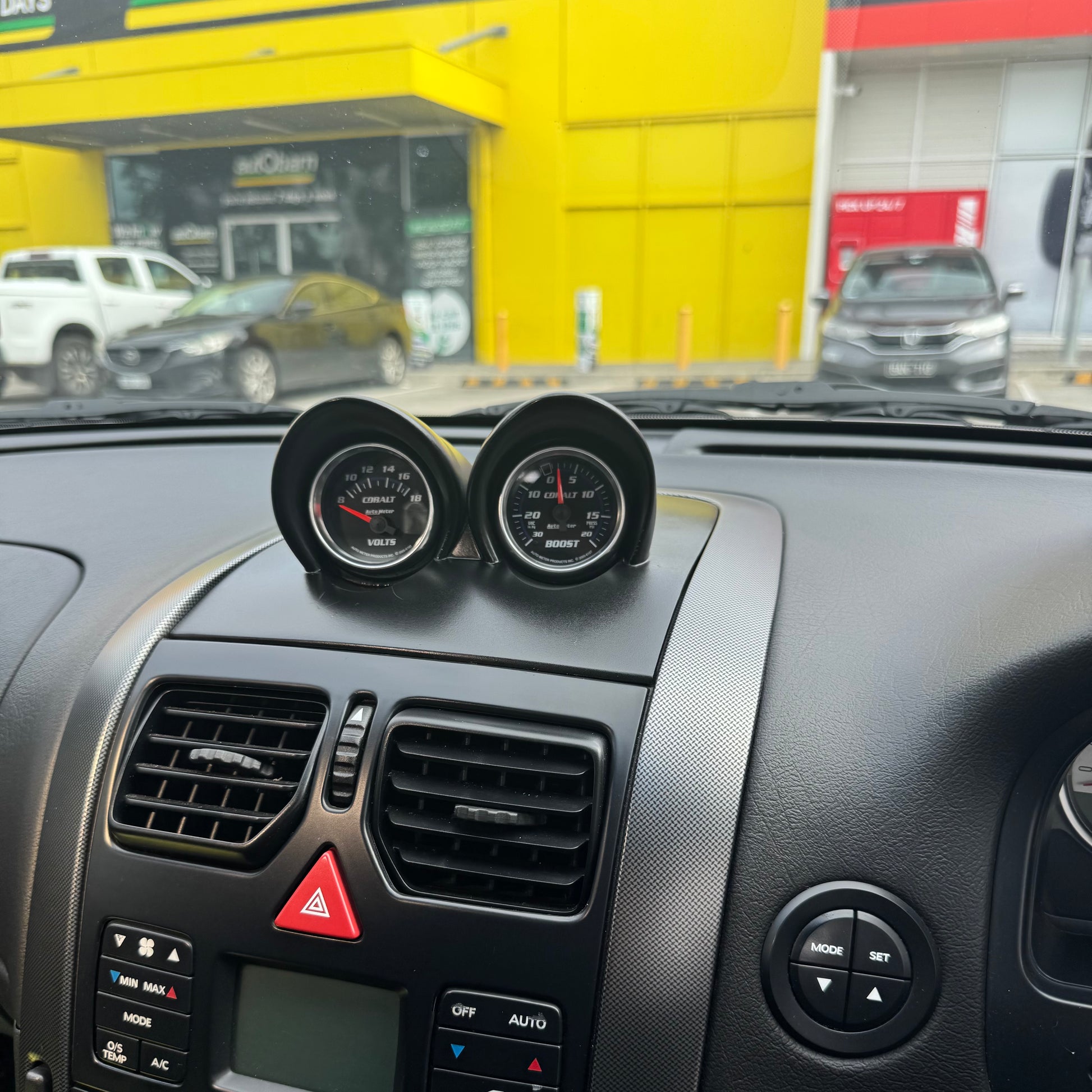 Painted satin black gauge pod installed with 52mm gauge position visible for quick glance readability while driving.