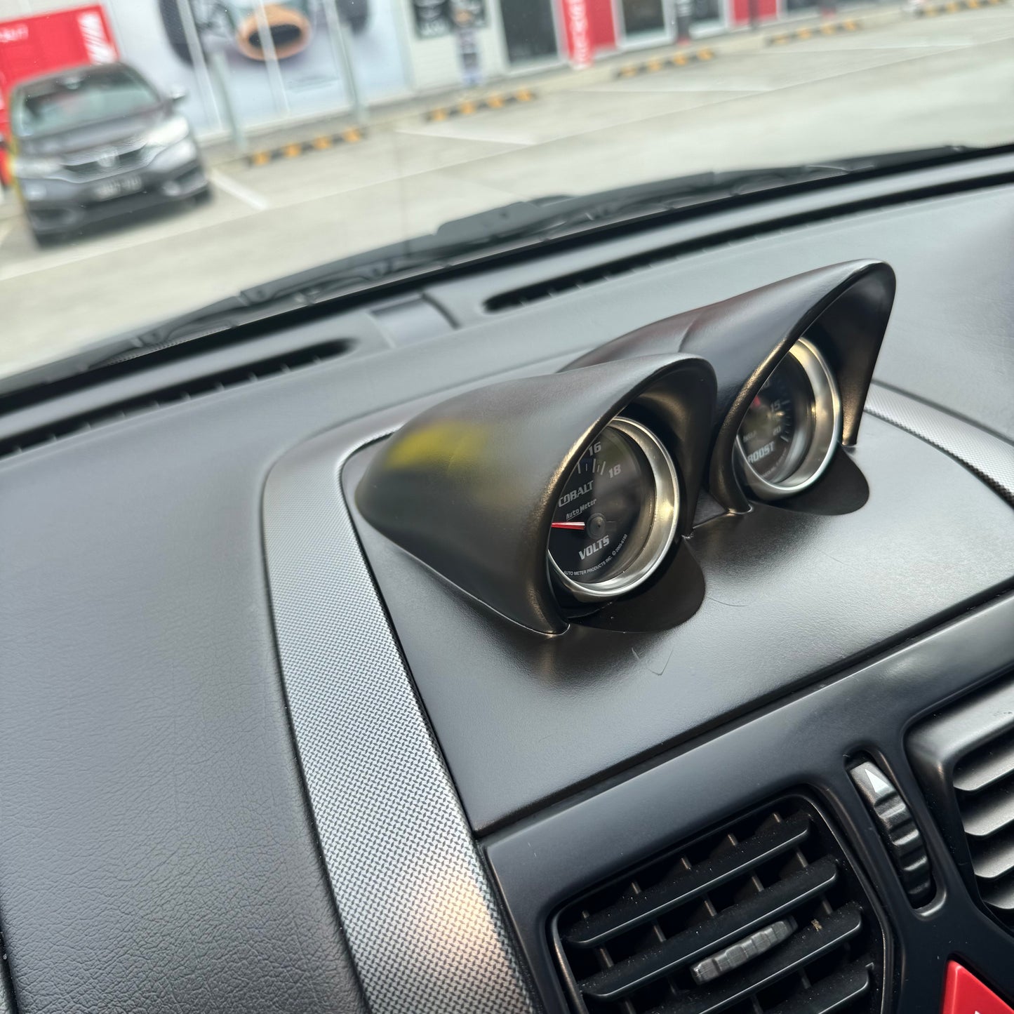 Painted satin black binnacle gauge pod installed in VY dash, angled view showing flush fitment and factory-style look.