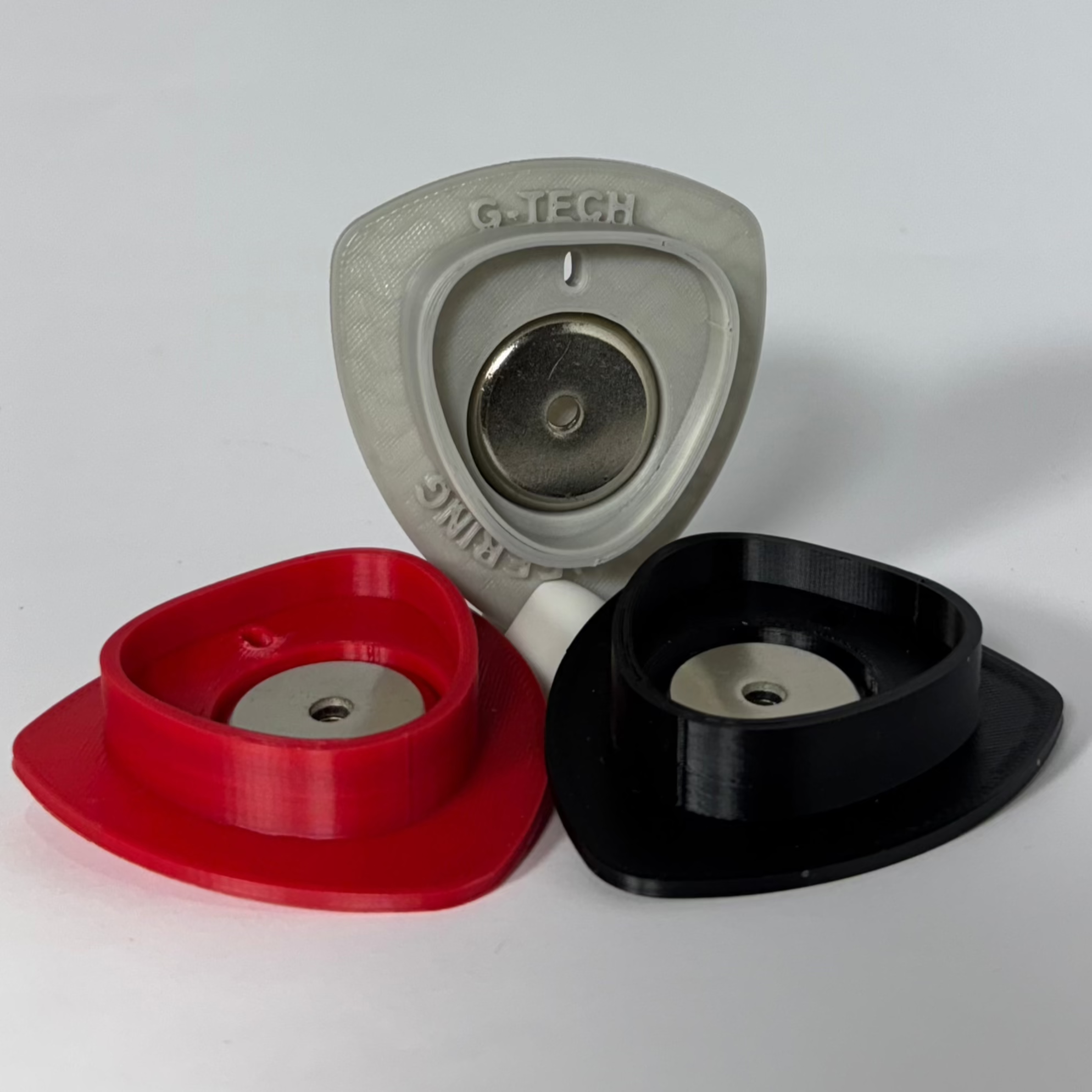 Magnetic base for Milwaukee M12 batteries, perfect for secure storage on metal surfaces.