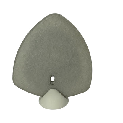 Milwaukee M12 battery magnetic base for tool storage and stable mounting on metal surfaces.