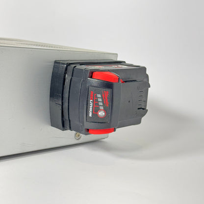 Milwaukee M18 magnetic base made from TPU, designed for secure storage and tool mounting on metal surfaces without shattering.